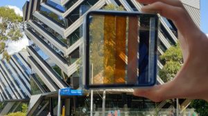 A semi-transparent perovskite solar cell with contrasting levels of light transparency.
