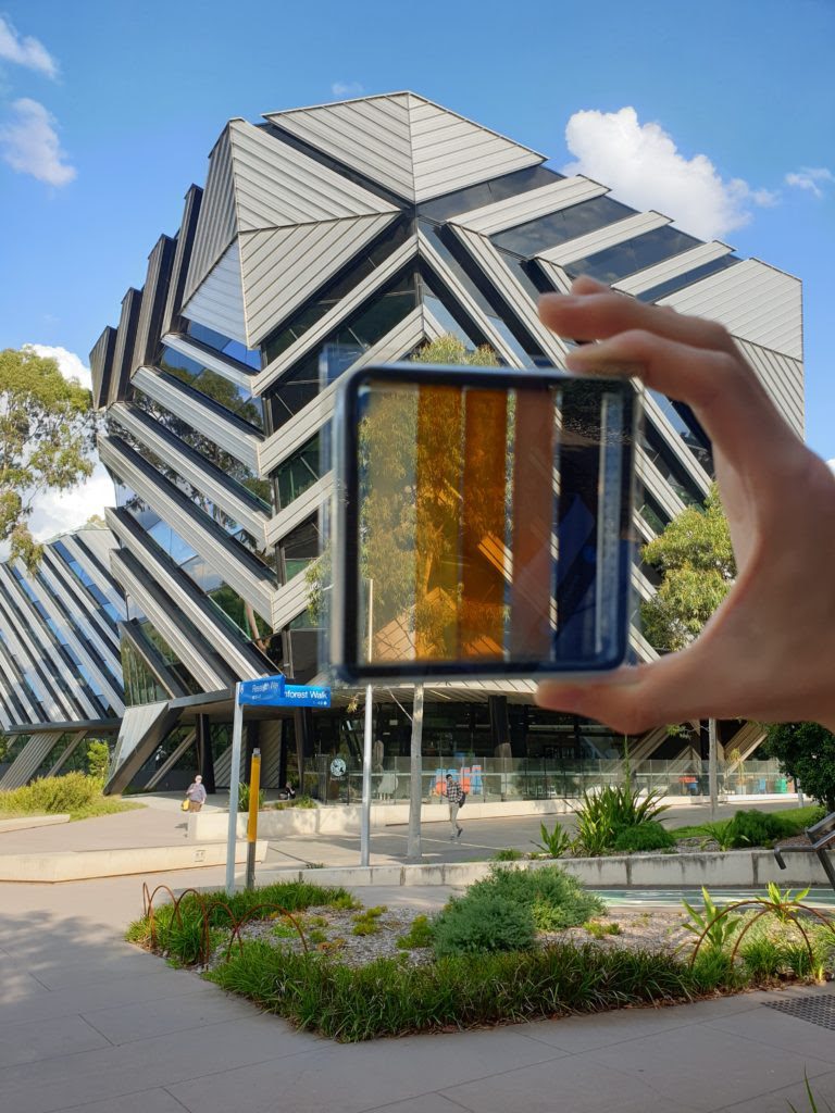 A semi-transparent perovskite solar cell with contrasting levels of light transparency.